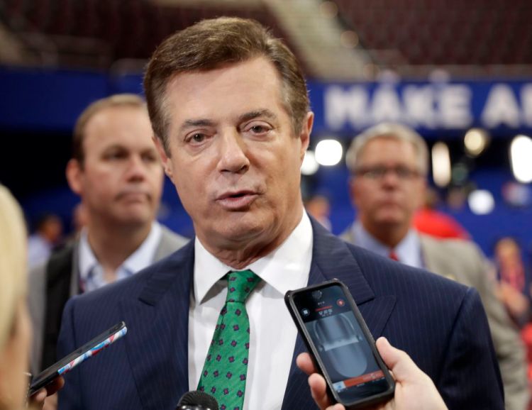Paul Manafort talks to reporters on the floor of the Republican National Convention in Cleveland on July 17, 2016. Manafort worked as Trump's unpaid campaign chairman last year from March until August. Trump asked him to resign after it was revealed that Manafort had orchestrated a covert Washington lobbying operation until 2014 on behalf of Ukraine's ruling pro-Russian political party.