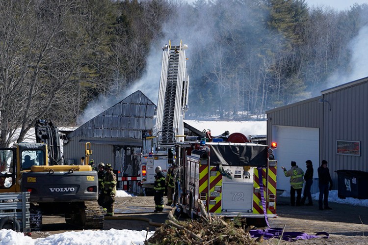 Firefighters at the scene of the barn fire on Simpson Road in Saco.