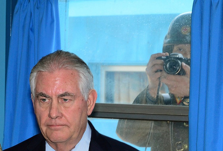 On Friday a North Korean soldier,  tries to take a photograph through a window while U.S. Secretary of State Rex Tillerson visits the U.N. Command Military Armistice Commission at the border village of Panmunjom in South Korea, which has separated the two Koreas since the Korean War.