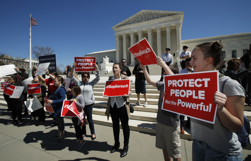 Protesters gather outside the Supreme Court last Wednesday to protest the nomination of Judge Neil Gorsuch to replace the late Justice Antonin Scalia on the high court.