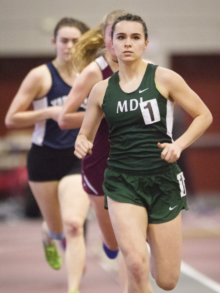 Mt. Desert Island's Tia Tardy leads the pack on her way to victory in the mile at the Class B indoor track state championships. Tardy also won the 800 and placed second in the 2-mile, then went on to finish second in the mile at the New England championships.