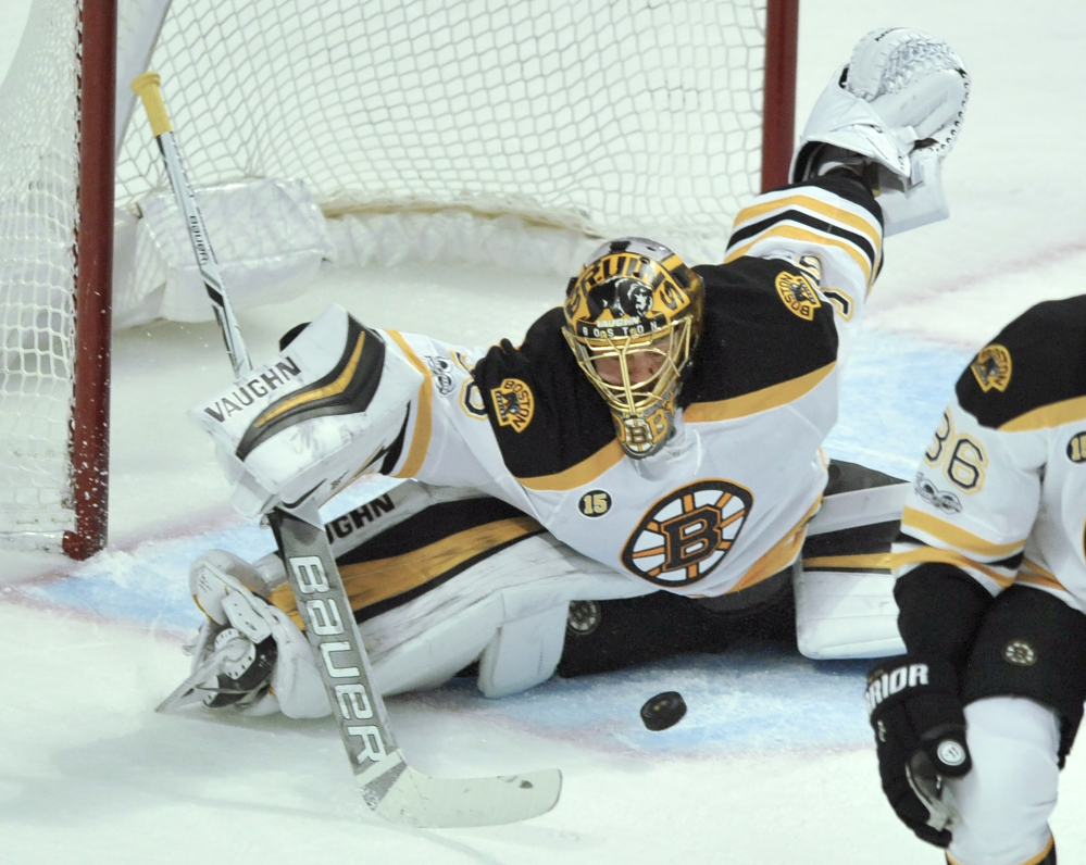 Anton Khudobin makes one of his 41 saves Sunday during the Bruins' 3-2 win over the Chicago Blackhawks. (Associated Press/Paul Beaty)