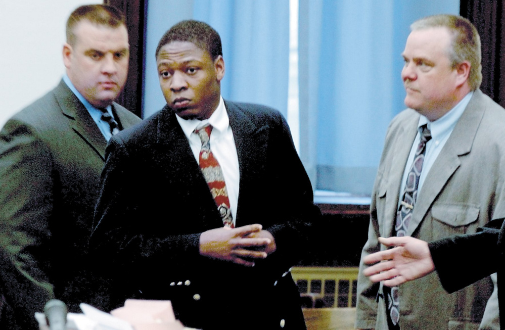 Daniel L. Fortune, center, is escorted by deputies into the Somerset County Superior Court in Skowhegan for the first day of his trial in 2011.