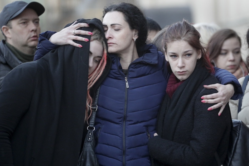 People mourn the victims of a suicide bomber in St. Petersburg, Russia, on Tuesday at a memorial at Technologicheskiy Institute subway station in St. Petersburg.