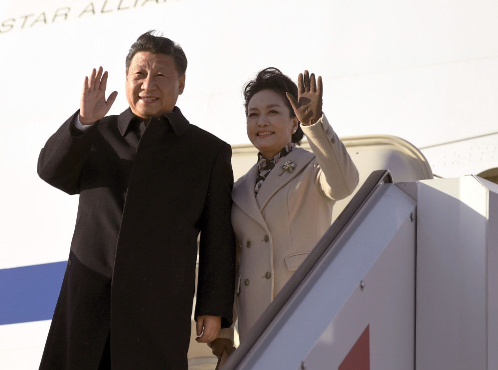 China's President Xi Jinping and his spouse, Peng Liyuan arrive Tuesday at Helsinki Airport, Finland, on their way to the United States. White House aides say two days of meetings with President Trump are intended to be an informal affair, but some foreign policy experts are worried that Trump will be at a disadvantage.