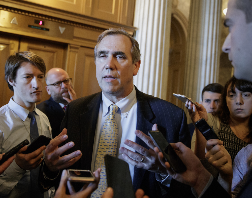 Sen. Jeff Merkley, D-Ore. speaks to reporters just outside the Senate chamber on Capitol Hill in Washington, Wednesday after ending a 15-hour, all-night talk-a-thon as the Senate heads toward a showdown over the confirmation vote for Supreme Court justice nominee Neil Gorsuch.