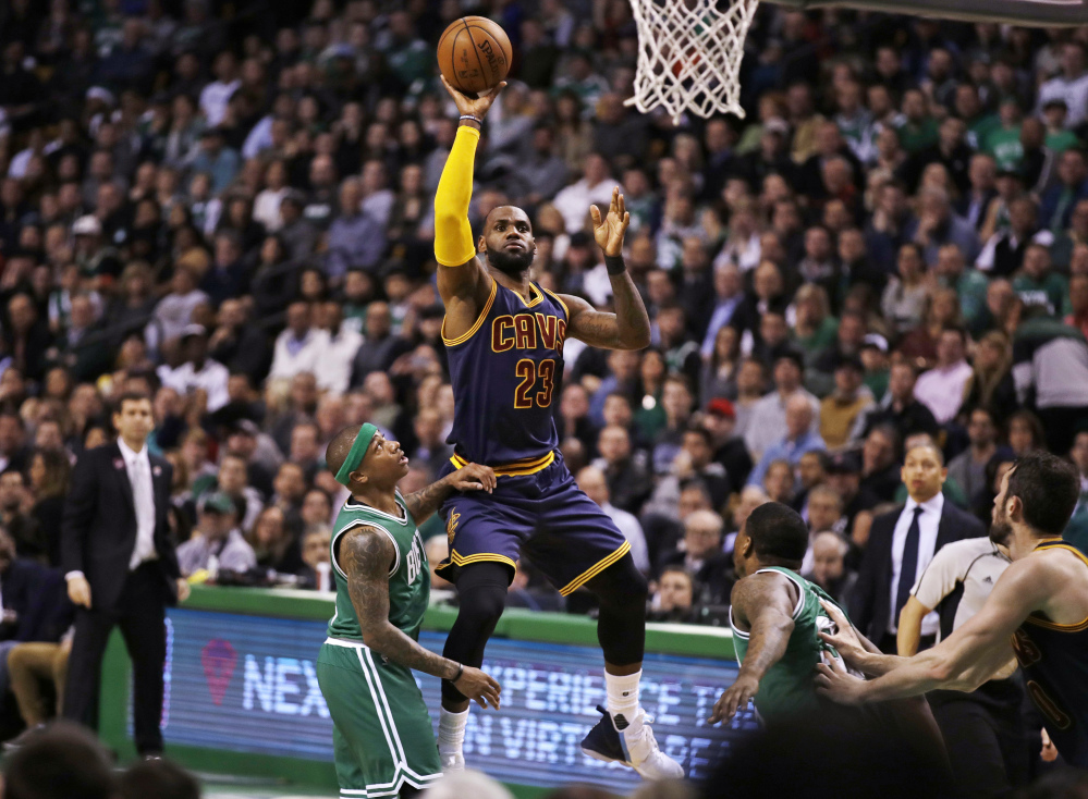 Cleveland's LeBron James shoots over Boston's Isaiah Thomas in the second quarter Wednesday night in Boston.