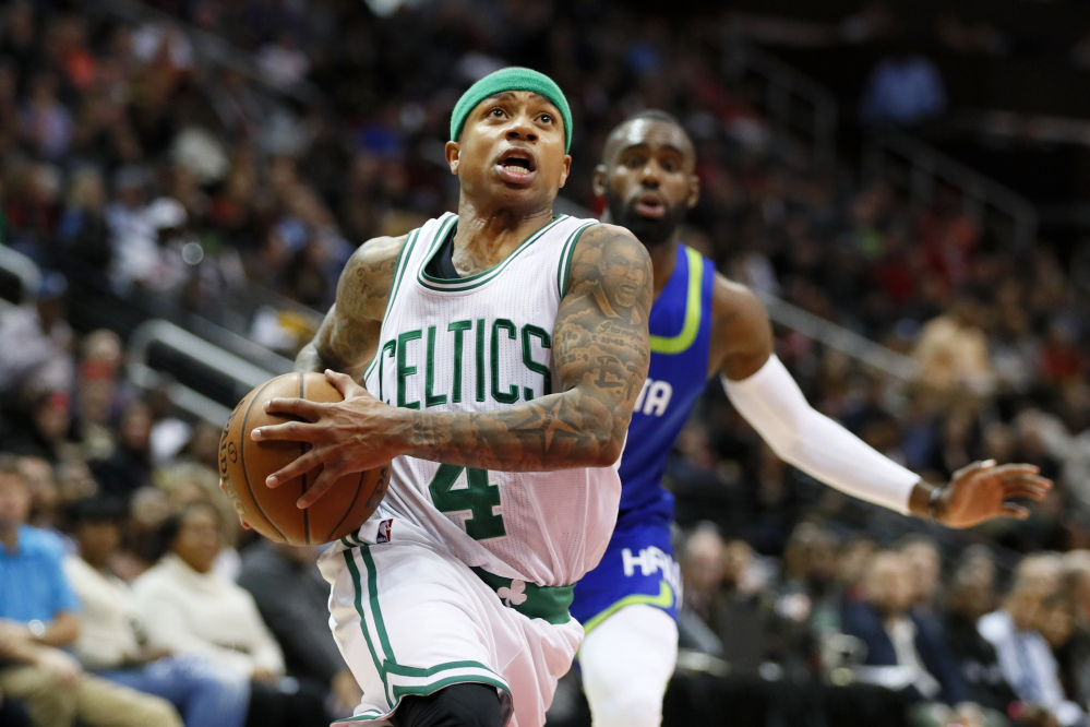 Boston's Isaiah Thomas drives to the basket in the first half of Thursday night's game at Atlanta.