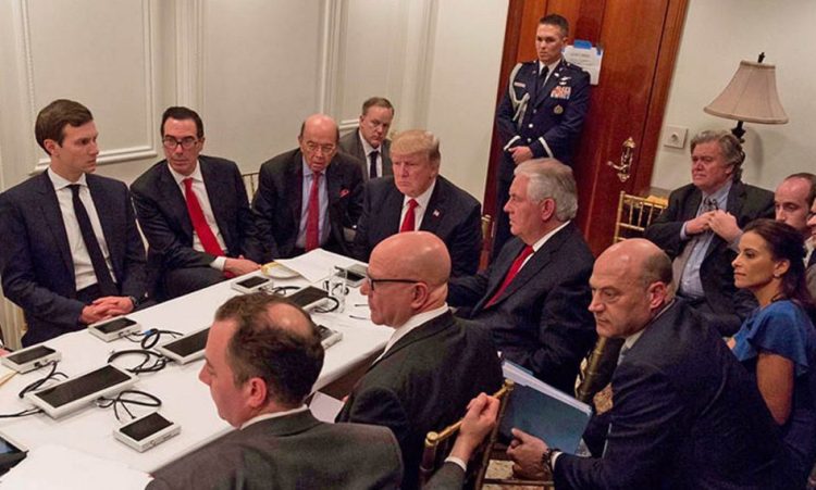 President Trump and his national security team are briefed via videoconference by Gen. Joseph Dunford, chairman of the Joint Chiefs of Staff, on the missile strike on Syria. The meeting was held in the Sensitive Compartmented Information Facility at Trump's Mar-a-Lago resort in Florida. White House Press Secretary Sean Spicer said the image was digitally edited for security purposes.