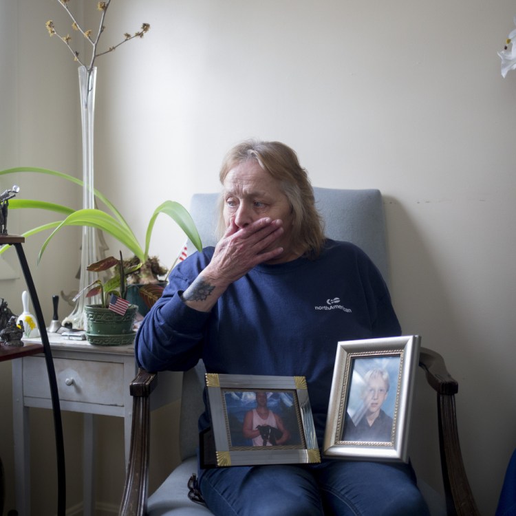 Judy McEwen cries as she poses for a portrait with photos of her son, Mark Shackelford, who died from a drug overdose in November 2016. "(Mark) was more than a drug addict and a statistic. He was a loving, caring man, with dreams and hope for a great life," his mom said.