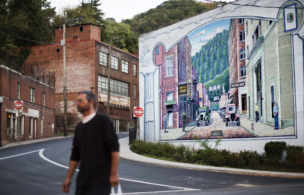 A mural depictis a more vibrant time in Welch, W.Va. As coal has declined, people have fled and desperation has taken hold. Many residents turned to drugs to cope.