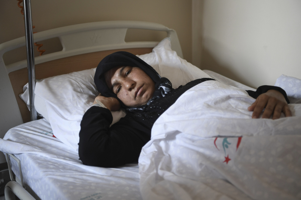 A Syrian woman rests in a hospital in Reyhanli, Turkey, on Friday. Turkish media, quoting Turkey's Justice Minister Bekir Bozdag and other officials, say autopsy results show Syrians were subjected to a chemical weapons attack in Idlib, Syria, on Tuesday. Associated Press photo