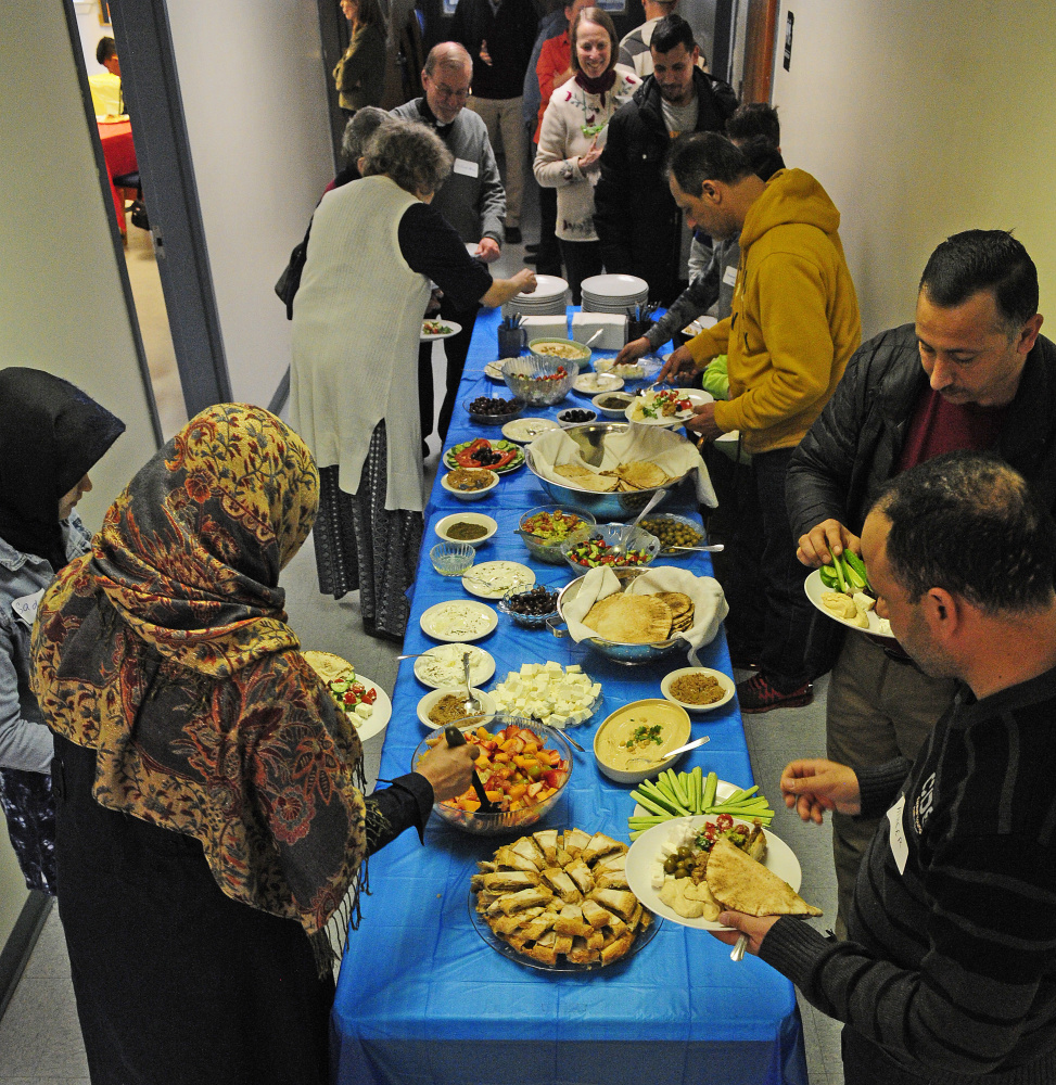 A buffet Saturday at a church in Augusta was the starting point for residents and city officials considering how to make a proposed community center for immigrants a reality.