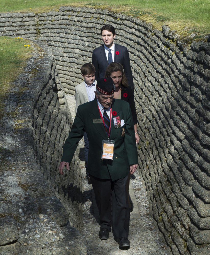 Richard Read, whose father fought at Vimy, guides Canadian Prime Minister Justin Trudeau, Sophie Gregoire Trudeau and their son Xavier near Arras, France, Sunday.