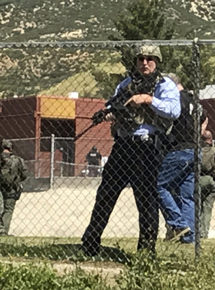 Emergency personnel respond to a fatal shooting inside North Park School in San Bernardino, Calif., on Monday.