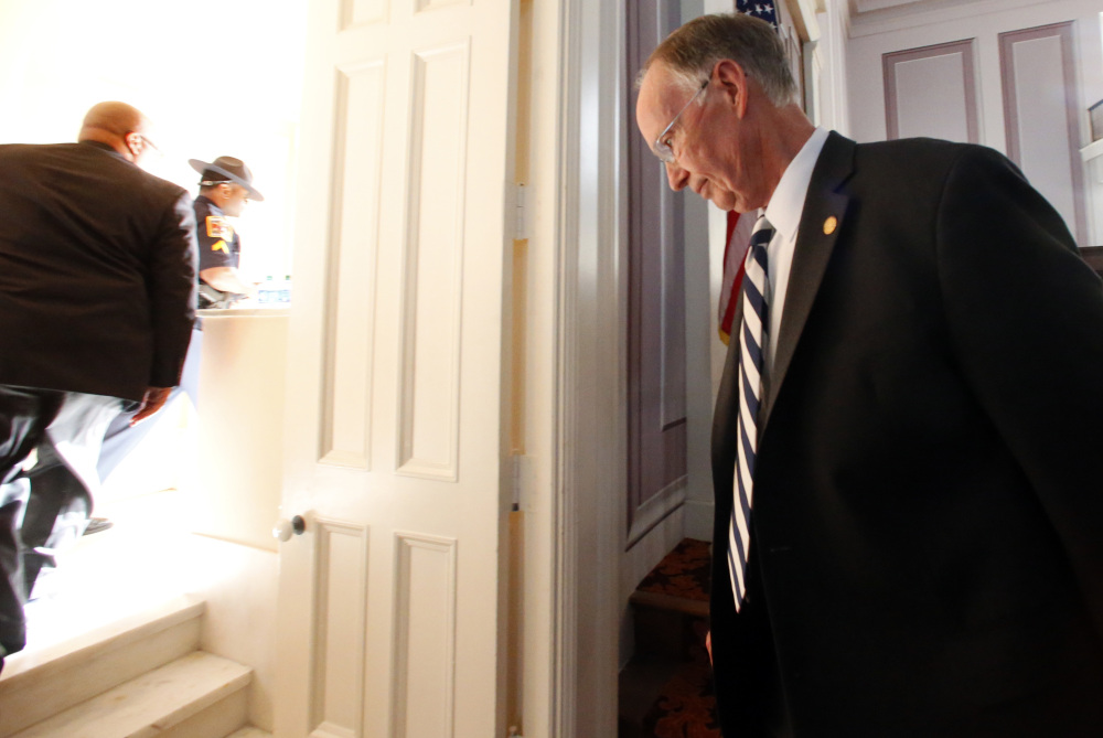 Former Alabama Gov. Robert Bentley walks out of the old House chamber following a statement after he resigned from office Monday in Montgomery, Ala.