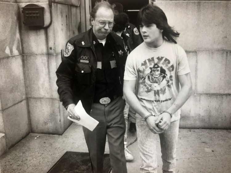 Anthony Sanborn Jr. is led from the Cumberland County Courthouse in April 1990 while waiting to be arraigned on a murder charge in the slaying of Jessica L. Briggs. 