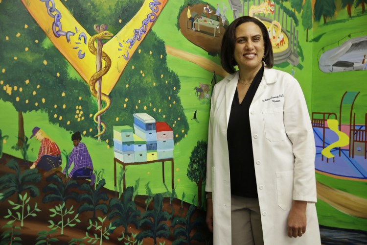 Dr. Kirsten Bibbins-Domingo, shown in the lobby of her office in San Francisco, always discusses the potential pros and cons of prostate cancer screening with her patients.