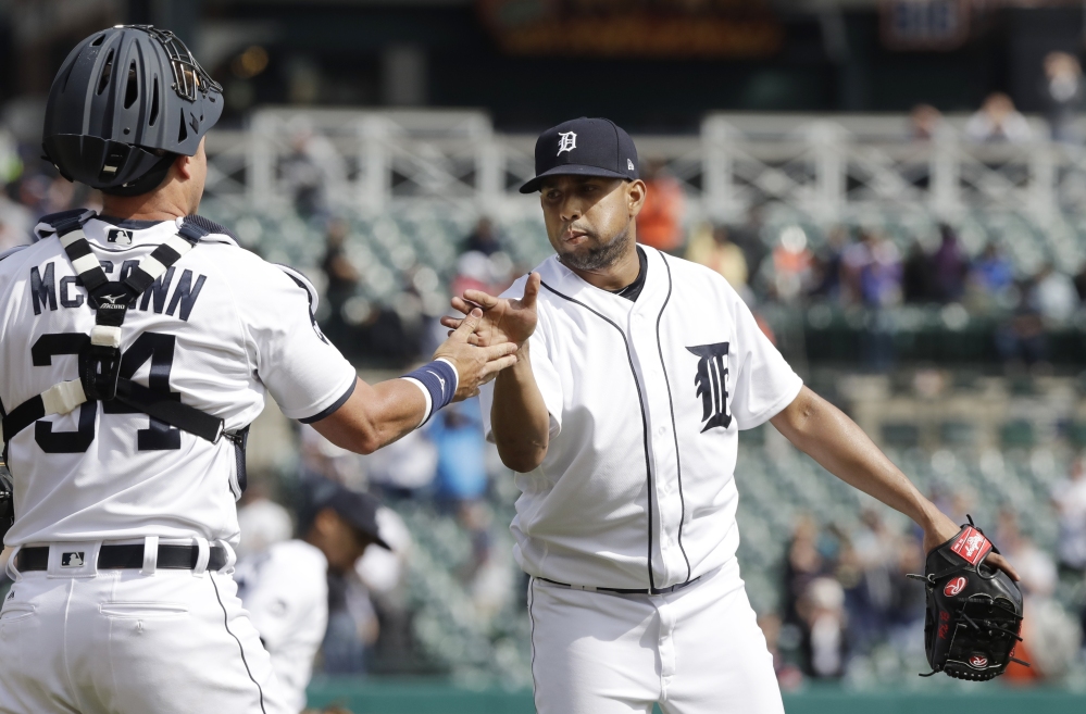 Francisco Rodriguez celebrates with catcher James McCann after closing out the Tigers' 2-1 win Monday over the Minnesota Twins. McCann drove in both Tiger runs with his third homer of the season.