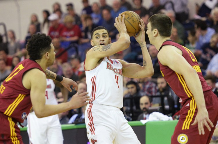 Abdel Nader and his Maine Red Claws teammates will look for a way to get past Stephan Hicks, left, Tyler Hansbrough and the rest of the Fort Wayne Mad Ants in Game 3.