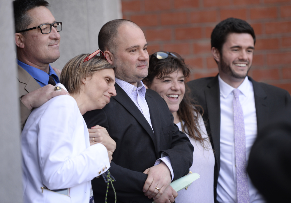 Anthony Sanborn Jr. appears after his release April 13 with his wife, Michelle, at left, and his attorney, Amy Fairfield, at right.
