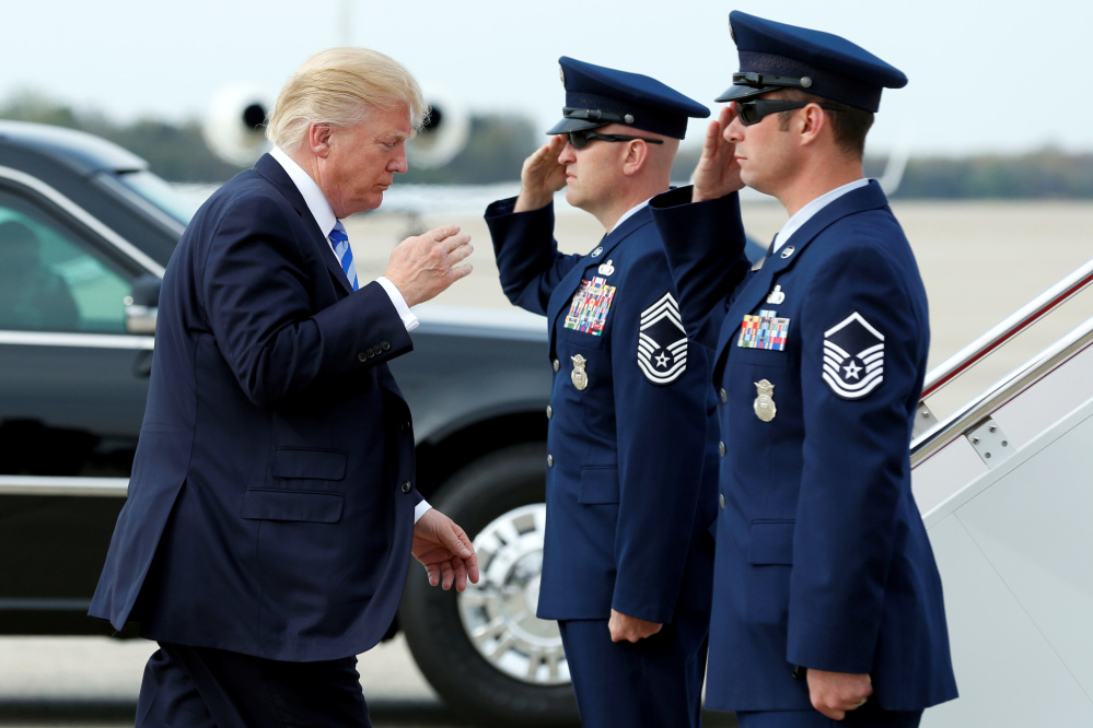 President Trump arrives to board Air Force One on Thursday at Joint Base Andrews outside Washington, D.C., before traveling to Palm Beach, Fla., for the Easter weekend.