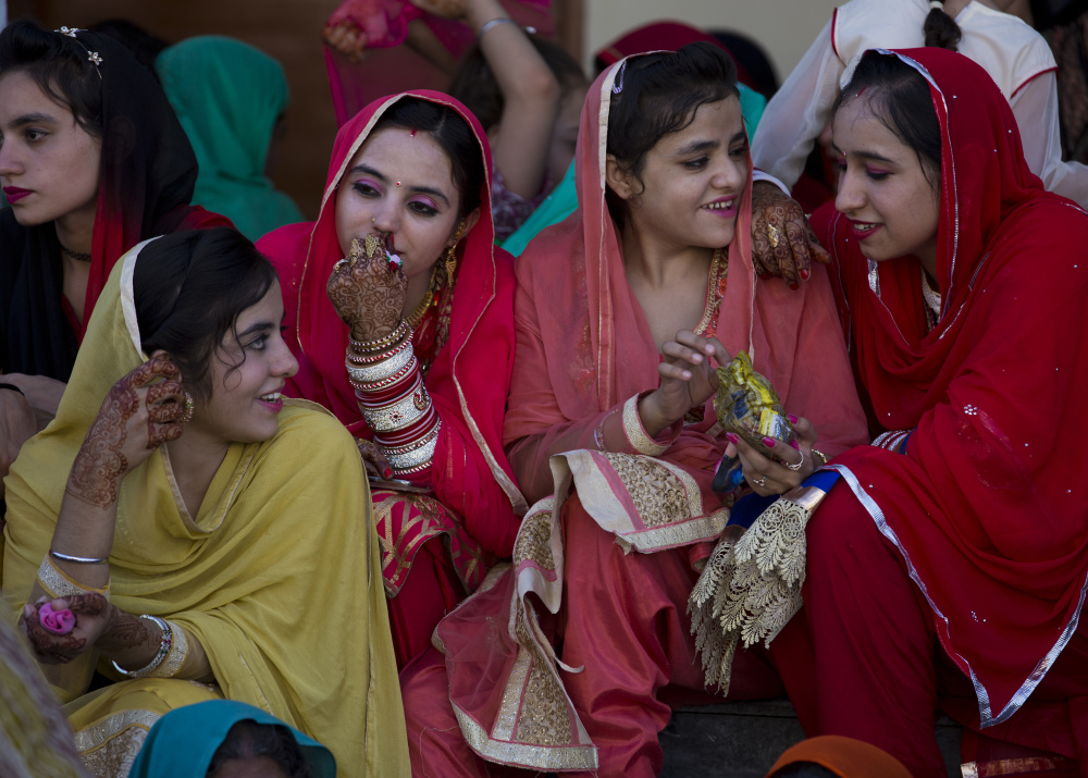 Girls from a Sikh community attend a festival in Hasan Abdal near Islamabad, Pakistan, on Friday. The pilgrims arrived from neighboring India to a shrine of Gurdwara Punja Sahib. The religion was founded in India to promote religious freedom, gender equality and opportunity for all.