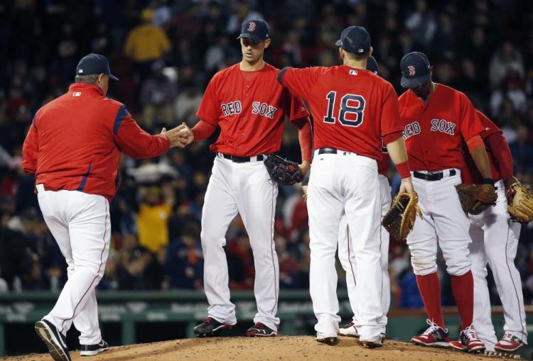 Boston's Rick Porcello, seen coming out of a game in April, is the defending Cy Young Award winner but has given up more runs than any pitcher in the American League this season. Despite that and other pitching problems, the Red Sox found themselves tied for the division lead Monday.