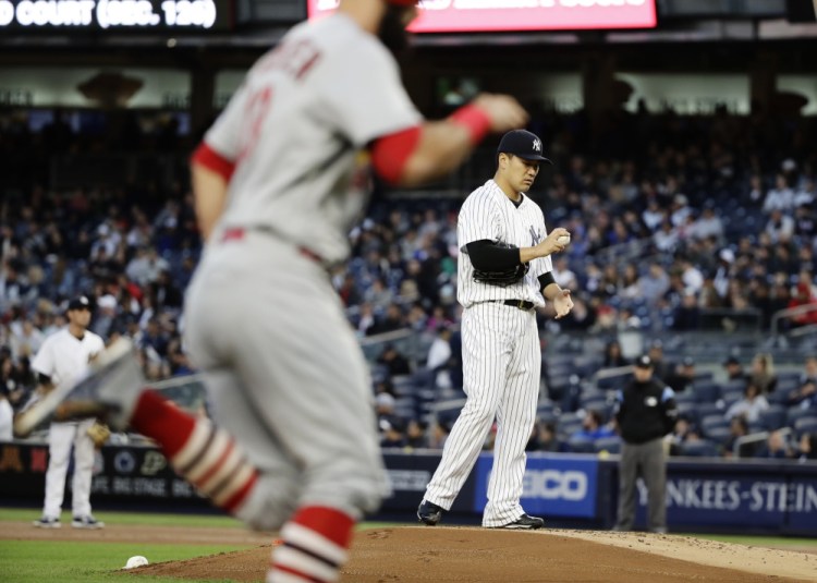 Masahiro Tanaka of the New York Yankees allowed a two-run homer to Matt Carpenter in the first inning Friday night, but recovered to lead the Yanks to a 4-3 victory at home.