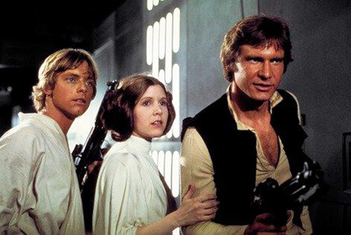 Photo provided by Twentieth Century Fox Home Entertainment shows, from left, Mark Hamill as Luke Skywalker, Carrie Fisher as Princess Leia Organa, and Harrison Ford as Han Solo in the original 1977 "Star Wars: Episode IV – A New Hope." 