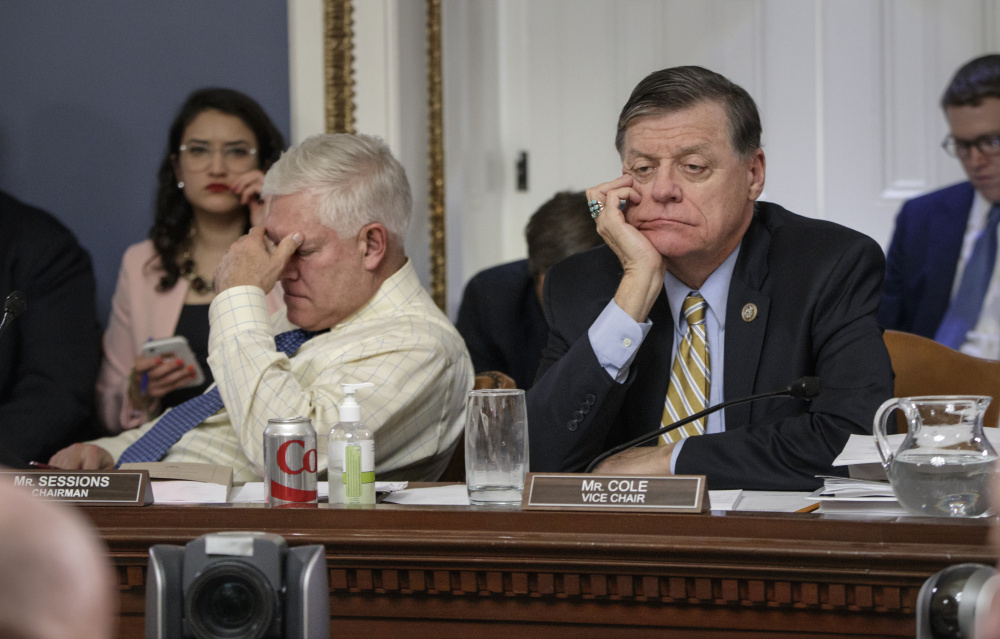 House Rules Committee Chairman Rep. Pete Sessions, R-Texas, left, and Rep. Tom Cole, R-Okla., the vice chair, show their frustration in March during a protracted debate over health care. Republicans are hoping to avoid a similar outcome when debate begins over the budget next week.