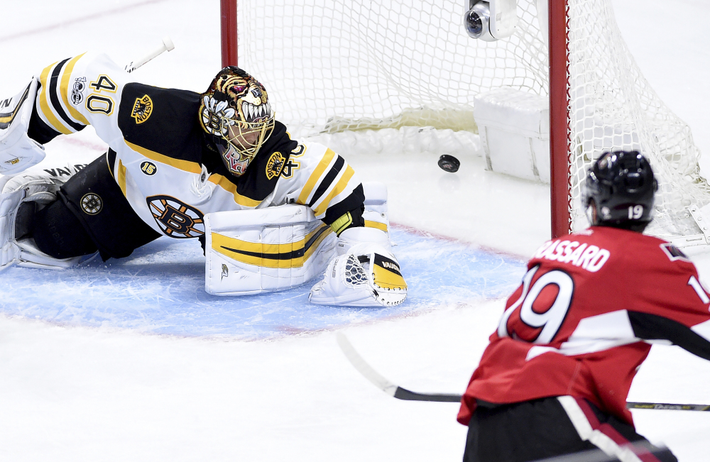 Ottawa center Derick Brassard scores on Boston goalie Tuukka Rask during third period of Saturday's playoff game in Ottawa. Ottawa scored two goals in the third period, then again in overtime to beat the Bruins 4-3 and tie their playoff series 1-1. (Sean Kilpatrick/The Canadian Press)