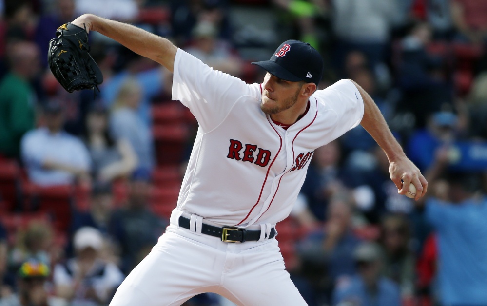 Chris Sale delivers a pitch for the Red Sox against Tampa Bay in Boston on Saturday. Sale earned his first win with the Red Sox, striking out 12 and walking three with just one earned run over seven innings. (Associated Press/Michael Dwyer)