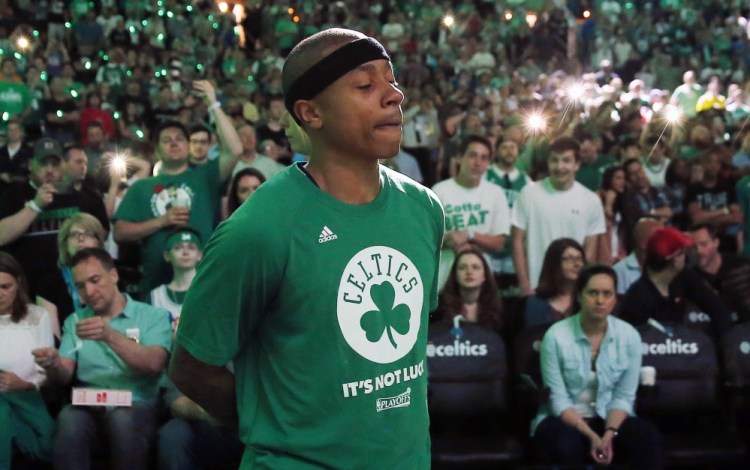 An emotional Isaiah Thomas stands by himself during pregame introductions April 16 in Boston. Thomas, playing the day after his sister died in a car accident, scored 33 points.