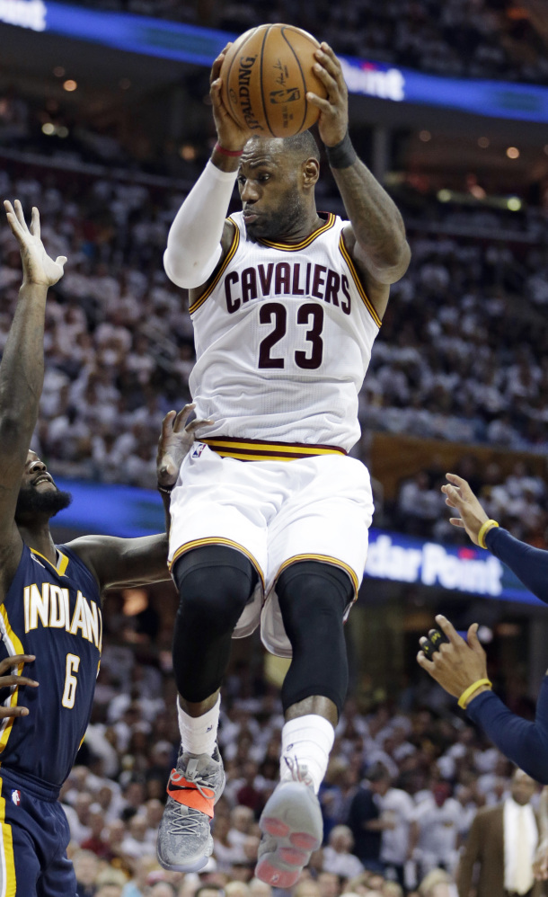 Cavaliers' LeBron James scored 25 points and grabbed 10 rebounds to help Cleveland beat Indiana 117-111 Monday in Cleveland.