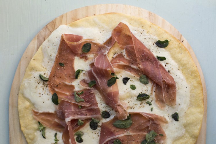 This pizza doesn't call for tomato sauce, allowing the burrata and cured ham flavors to come forth.
