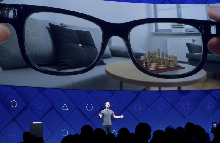 Facebook CEO Mark Zuckerberg speaks at his company's annual F8 developer conference Tuesday in San Jose, Calif. ""We're going to make the camera the first augmented reality platform," he told viewers.