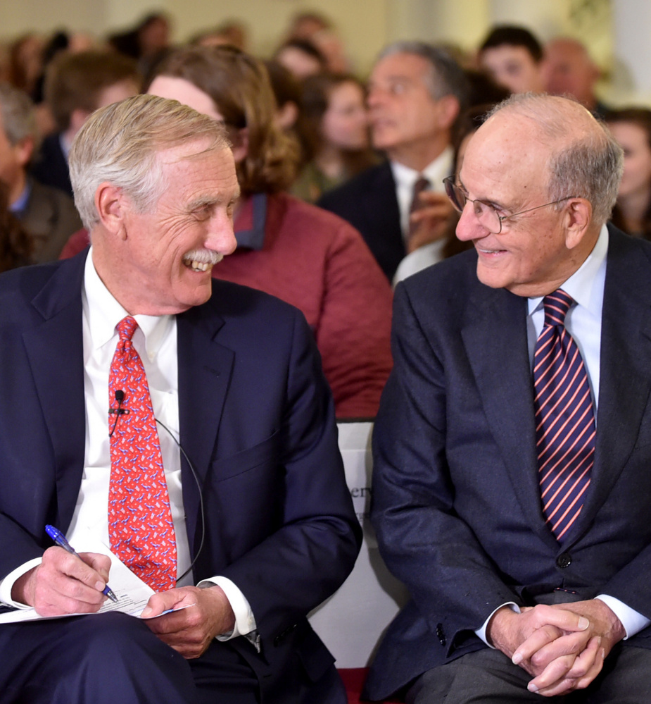 Sen. Angus King, left, and former Sen. George Mitchell chat before King's speech on international relations at the George J. Mitchell Distinguished International Lecture at Colby College Wednesday night.