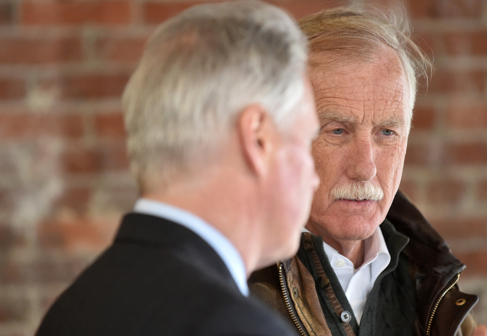 David Greene, president of Colby College, left, gives a tour Wednesday of the Haines Building on Main Street in downtown Waterville to U.S, Sen. Angus King.