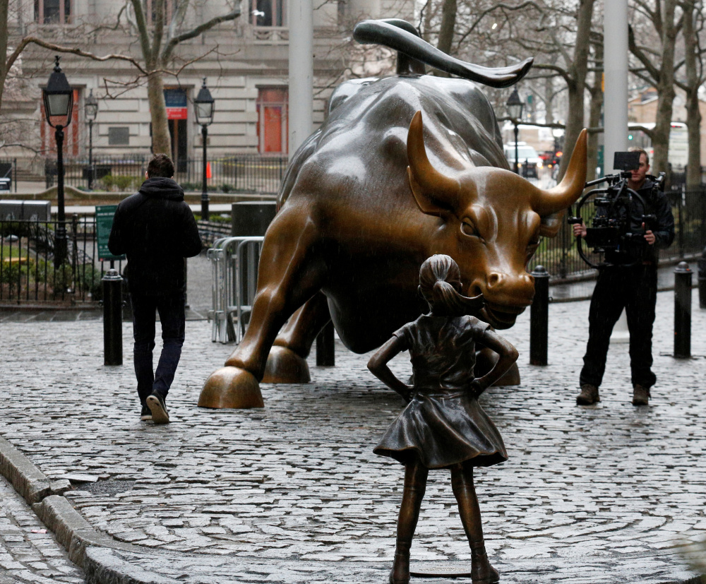 The "Fearless Girl" statue was installed by an investment firm in honor of International Women's Day, with an inscription at the base saying: "Know the power of women in leadership. She makes a difference. State Street Global Advisors."