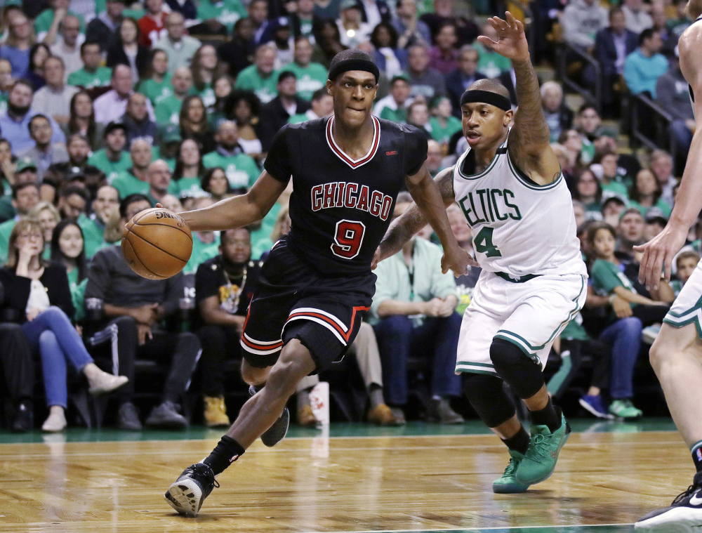 Chicago Bulls guard Rajon Rondo drives towards the basket past Boston Celtics guard Isaiah Thomas during Tuesday's playoff game in Boston. 
