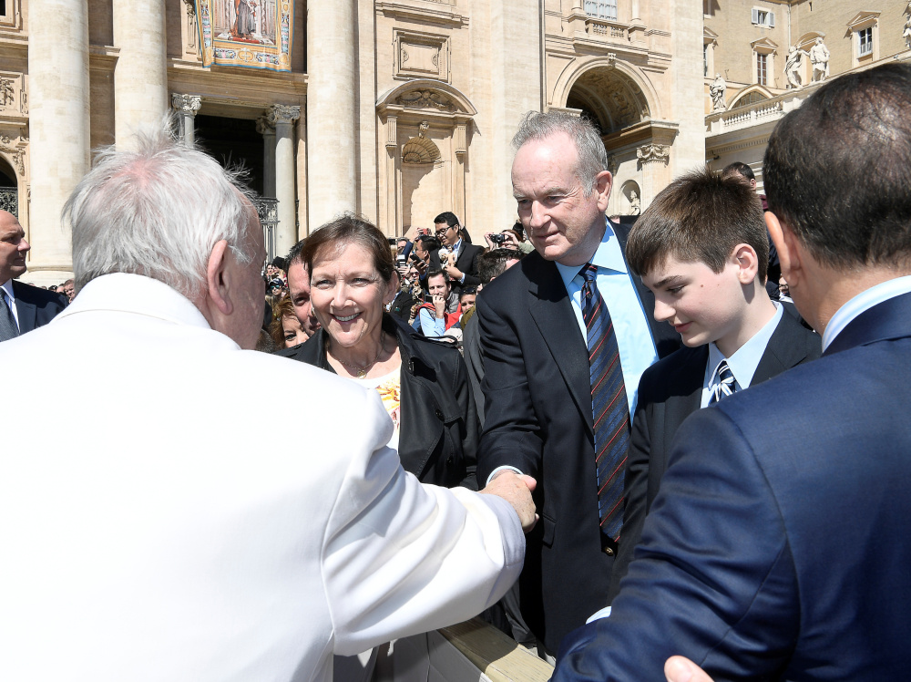 Fox News Channel host Bill O'Reilly shakes hands with Pope Francis during the Wednesday general audience in St. Peter's Square at the Vatican.