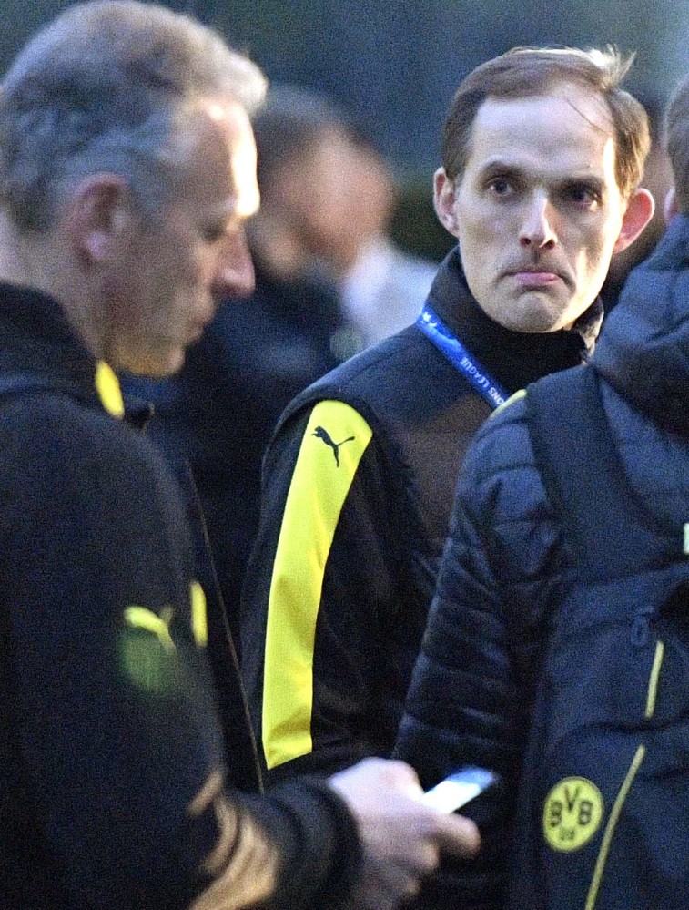 Thomas Tuchel, Borussia Dortmund head coach, stands outside the team bus after an April 11 explosion.