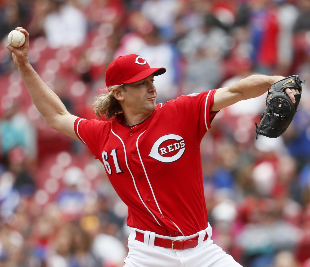 Cincinnati starting pitcher Bronson Arroyo pitched six innings, allowing two runs on three hits and the Reds beat the Cubs 7-5  in Cincinnati.