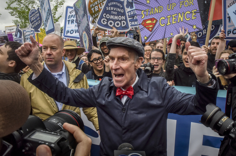 Bill Nye riles up the crowd as he takes his place at the head of the March for Science in Washington on Saturday.