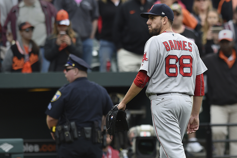 Red Sox reliever Matt Barnes walks off the field after being ejected for throwing at Manny Machado during the eighth inning Sunday.