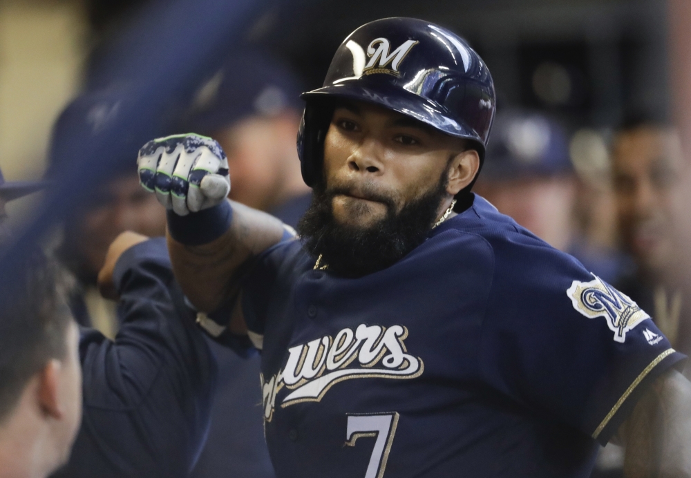 Milwaukee's Eric Thames celebrates after hitting the first of his two home runs in the Brewers' 11-7 win against Cincinnati on Monday in Milwaukee. Thames has a major league-leading 10 home runs, including seven in five games against the Reds.