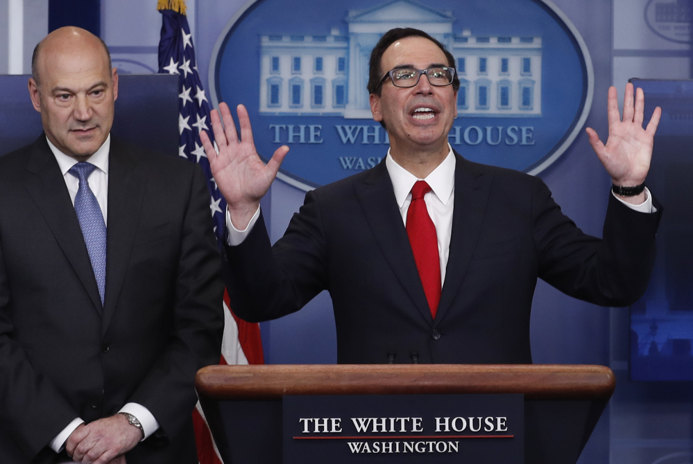 Treasury Secretary Steven Mnuchin, right, joined by National Economic Director Gary Cohn, speaks in the briefing room of the White House in Washington, Wednesday, in favor of President Trump's proposed plan to dramatically reduce corporate taxes in order to spur growth and job-creation.
