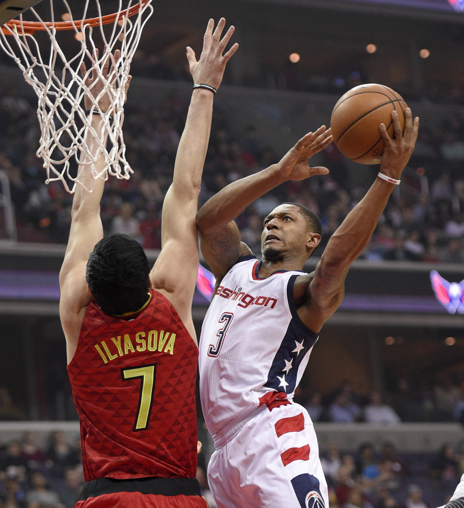 Bradley Beal of the Washington Wizards drives to the basket Wednesday night against Ehsan Ilyasova of the Atlanta Hawks during the first half of the Wizards' 103-99 victory at home. Washington leads the series, 3-2.