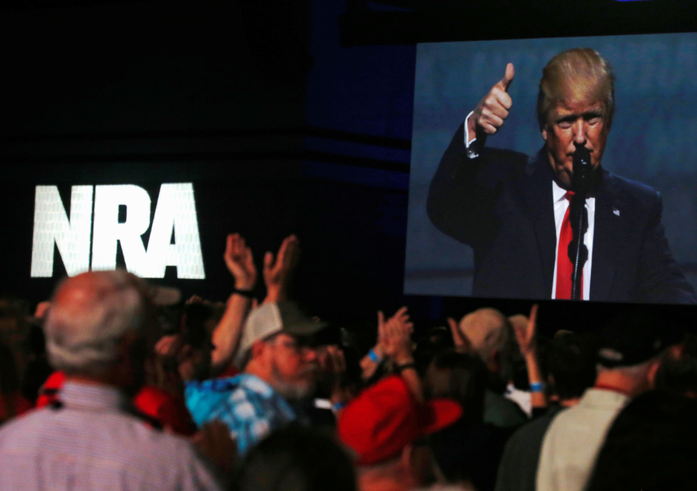 President Trump addresses the NRA's annual convention Friday in Atlanta. "You came through big for me, and I am going to come through for you,"  he said.